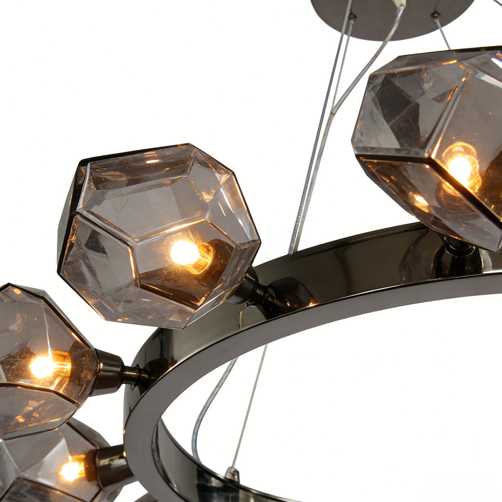 Close-up of a black round chandelier with multiple smoked glass pendants and minimalist circular design.