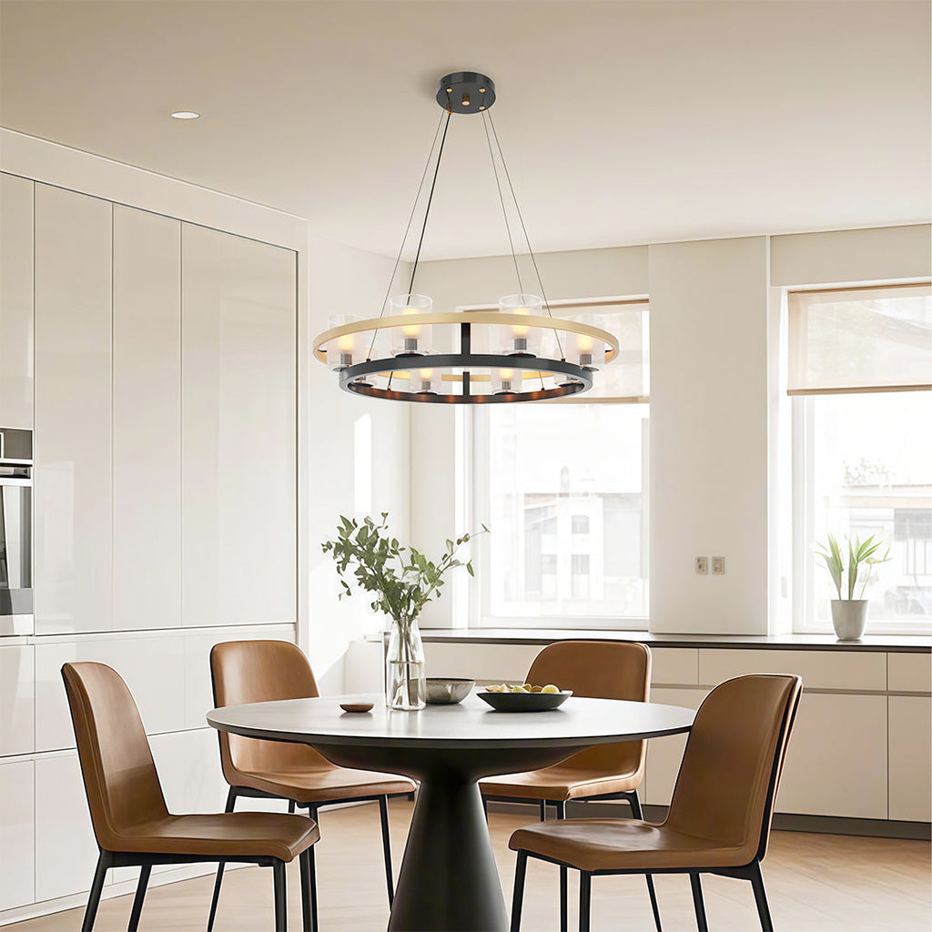 Elegant modern luxury chandeliers with a circular design, hanging above a dining table in a bright kitchen.