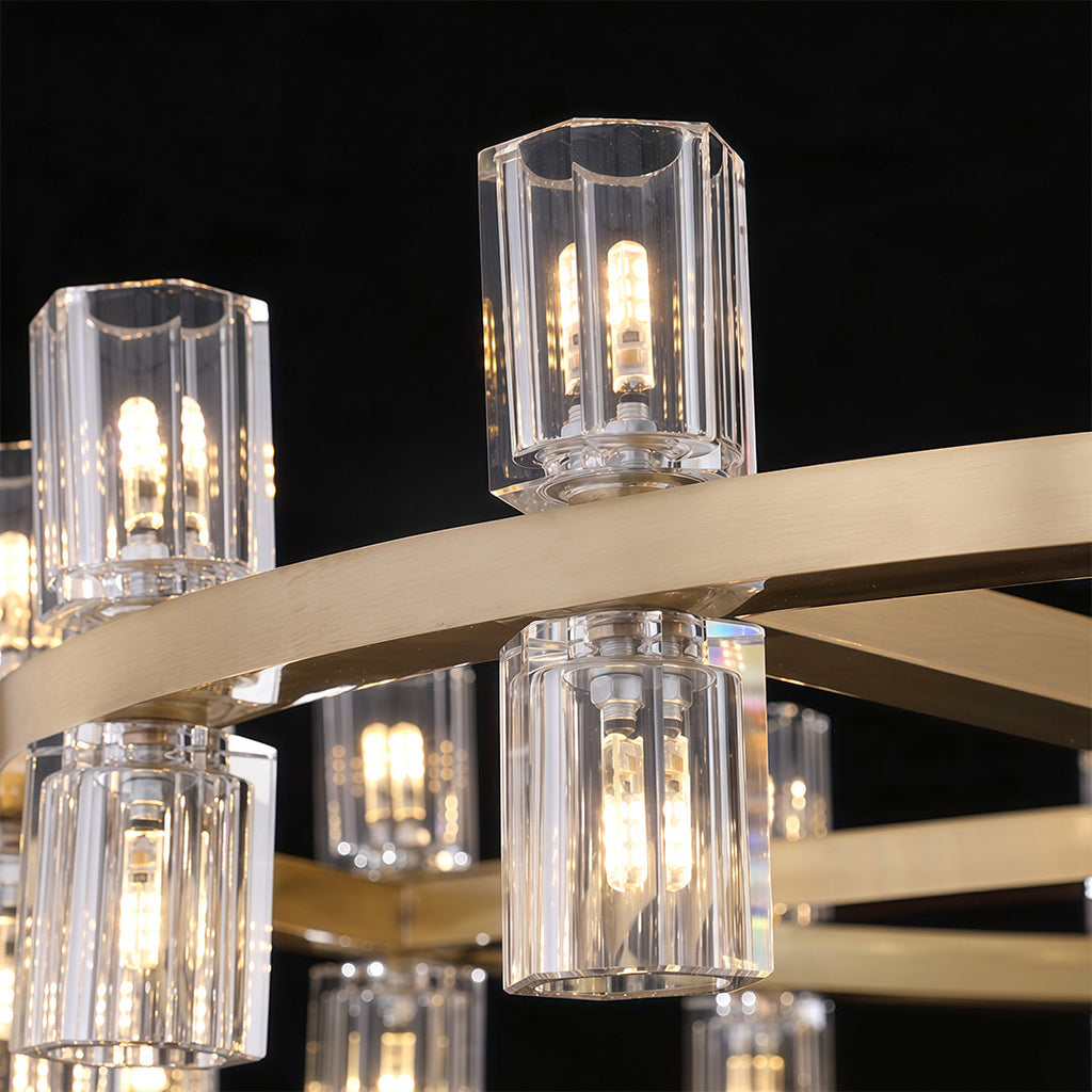Luxury crystal chandeliers close-up detail showcasing clear glass cylinders and brass hardware