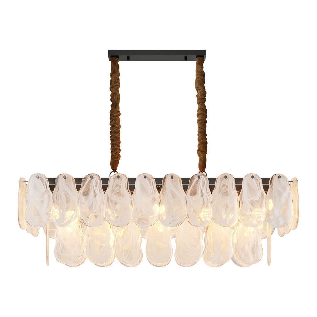 Midcentury modern chandelier lighting elegant dining space with round fluted table