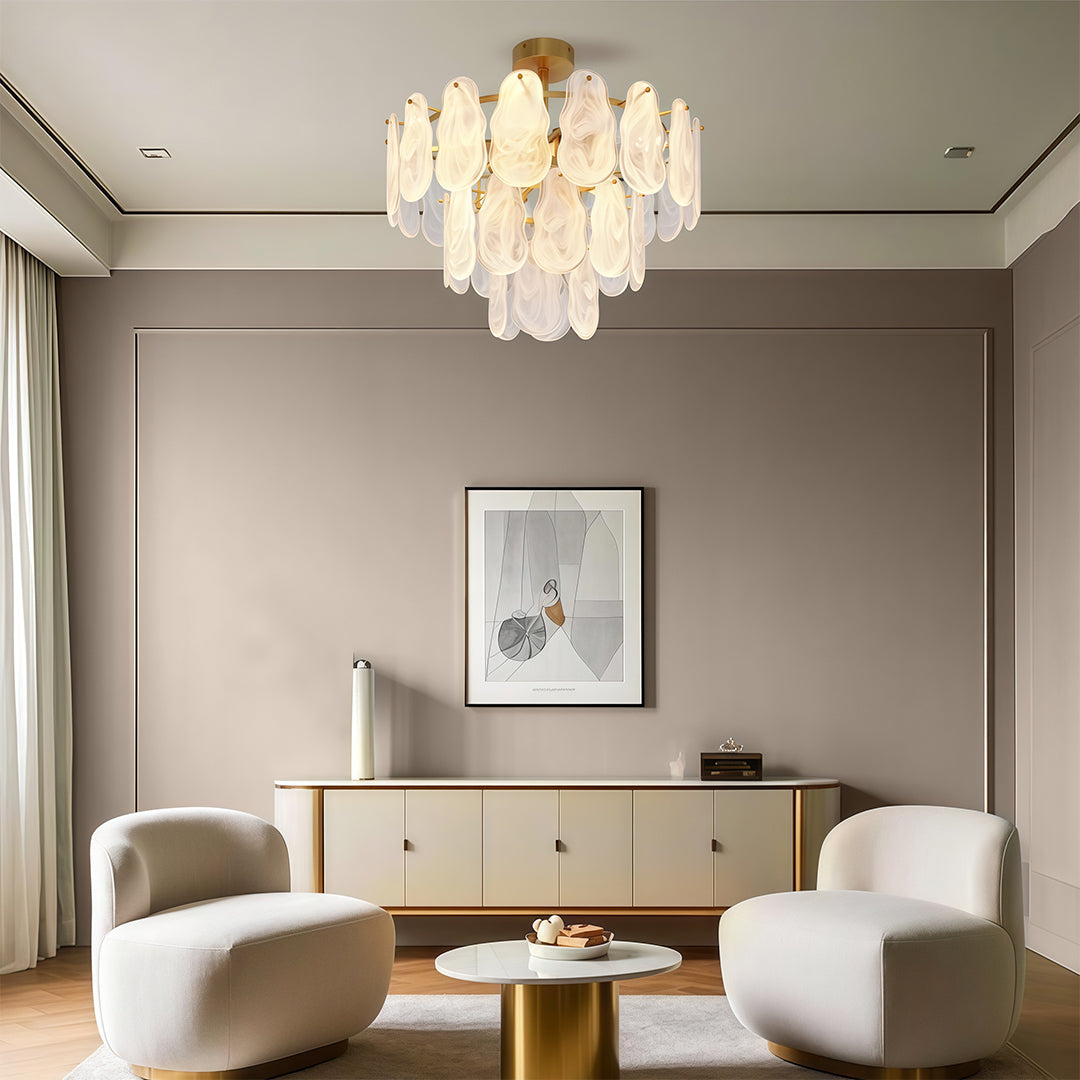Modern luxury chandeliers lighting luxury dining room with marble surfaces and statement furniture