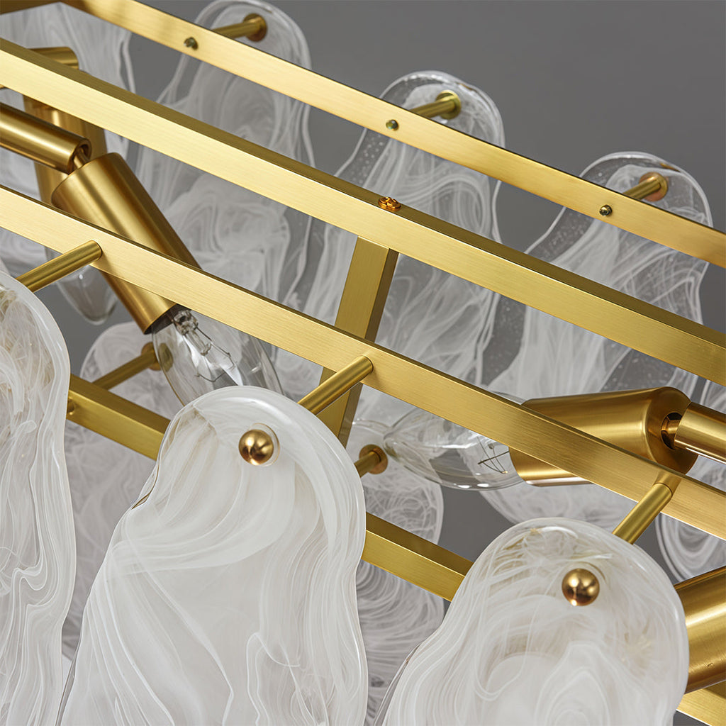 Modern luxury chandeliers illuminating sophisticated living room with grey tones and modern art