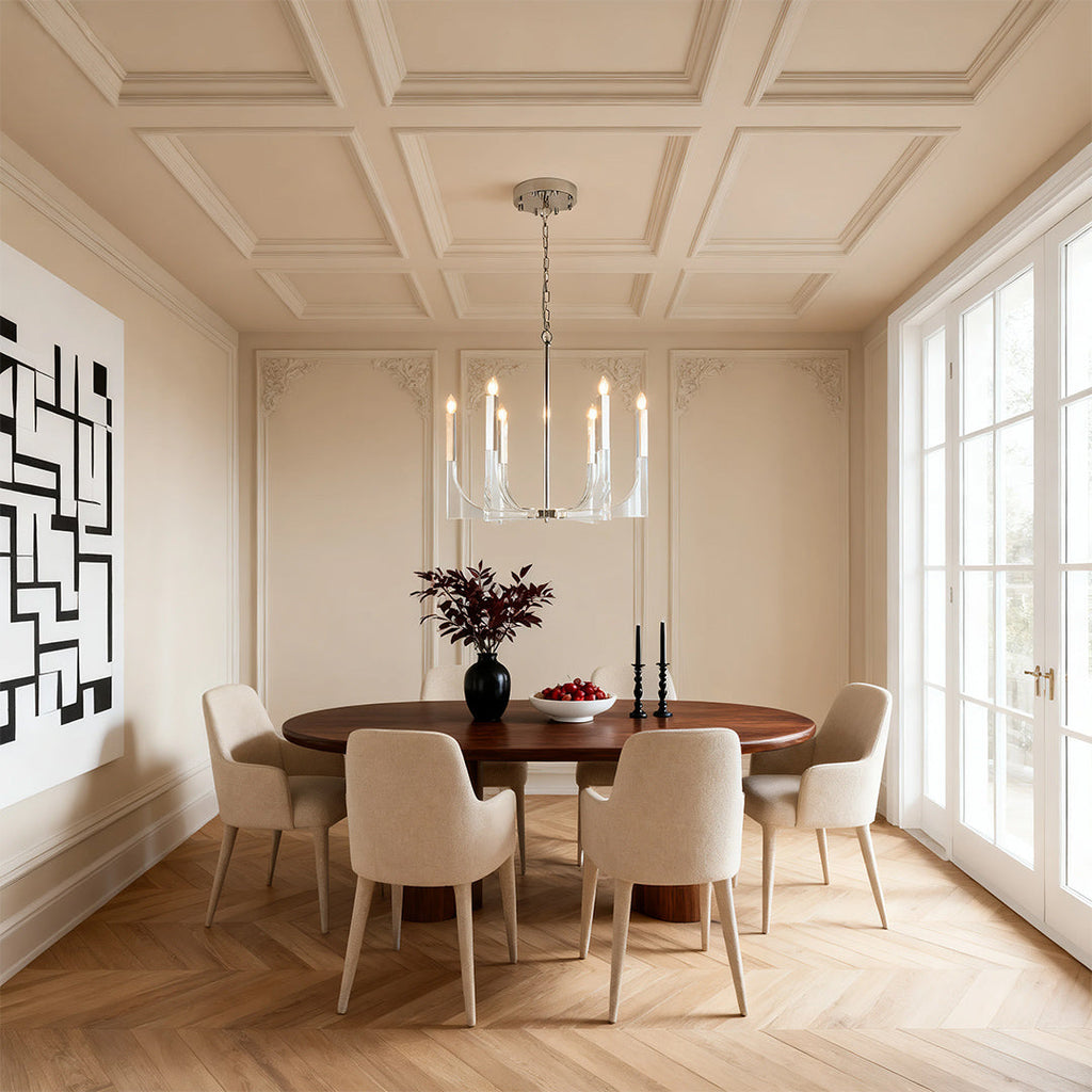 Elegant dining room with a polished chrome retro chandeliers illuminating an oval wood table and coffered ceiling.