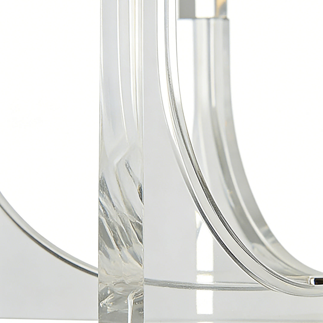 Close-up of acrylic chandeliers showcasing curved transparent acrylic arms with modern, minimalist lighting design.
