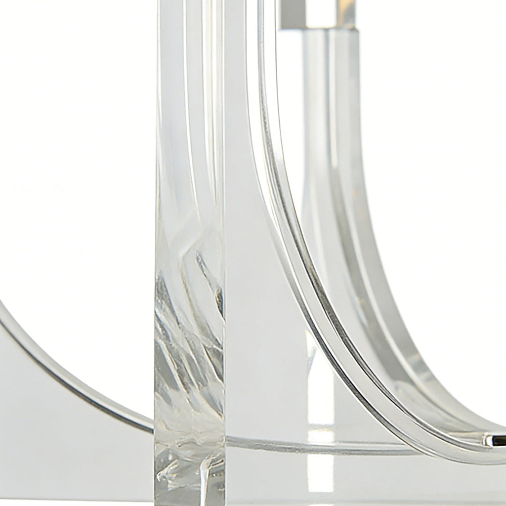 Close-up of acrylic chandeliers showcasing curved transparent acrylic arms with modern, minimalist lighting design.