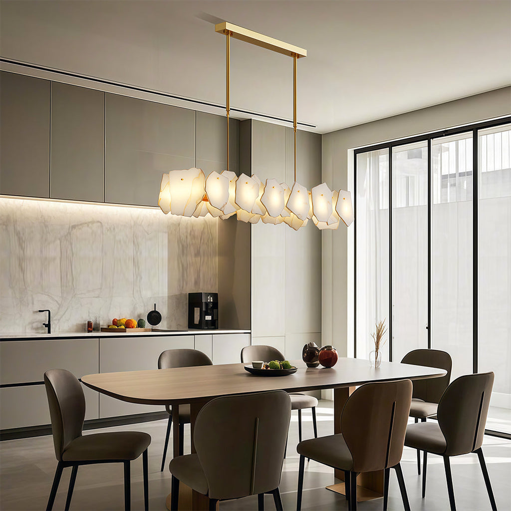 Modern luxury chandeliers enhancing contemporary dining room with architectural ceiling detail